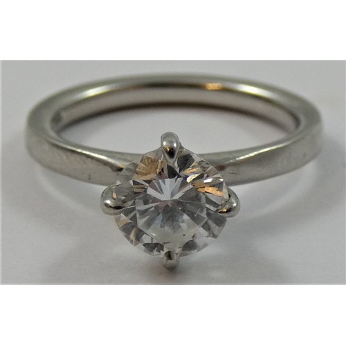 127 - A platinum and diamond single stone diamond ring, four claw set with a brilliant cut stone weighing ... 