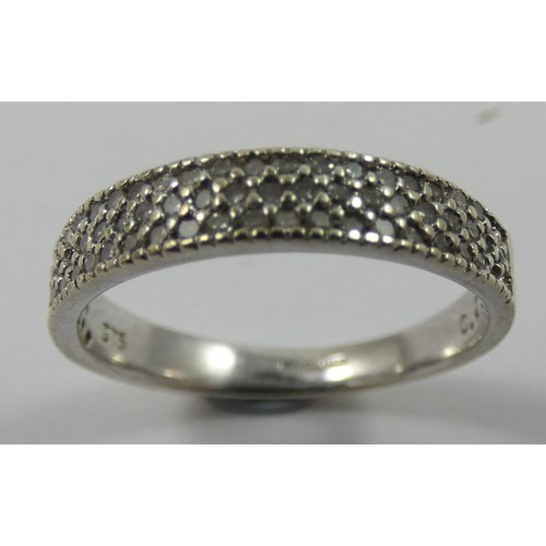 137 - A 9 ct white gold and diamond dress ring, set with three rows of single cut stones, size M 1/2