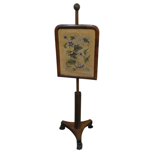 489 - A Victorian mahogany pole screen, with a tapestry mounted sliding panel, raised on a tripod base wit... 