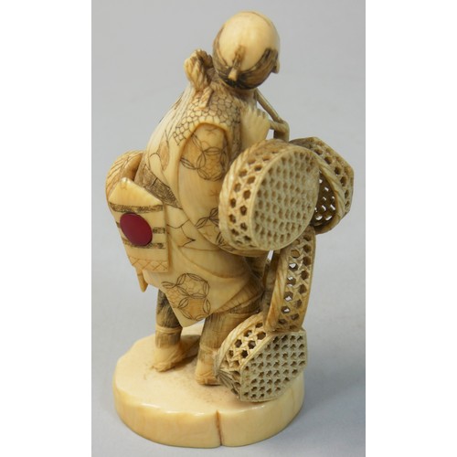 361 - A Japanese Meiji Period Ivory Okimono, by Toshimasa, in the form of a street vendor carrying baskets... 