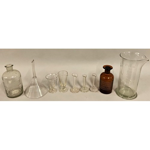 300 - A collection of c.1930's apothecary glassware, to include measuring apparatus, funnels, test tubes, ... 