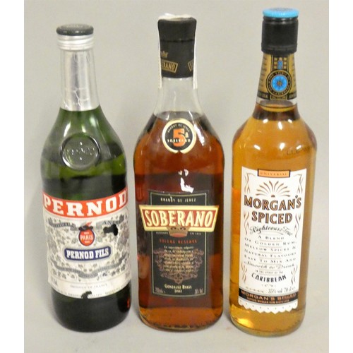 257 - Morgan's Spiced Rum, 70cl, together with a 70cl bottle of Pernod and a 70cl bottle of Soberano brand... 