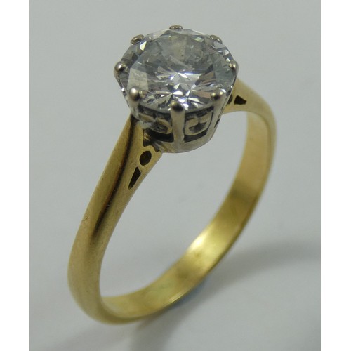 91 - A single stone diamond ring, claw set with a brilliant cut stone, calculated to weigh 1.20 cts, colo... 