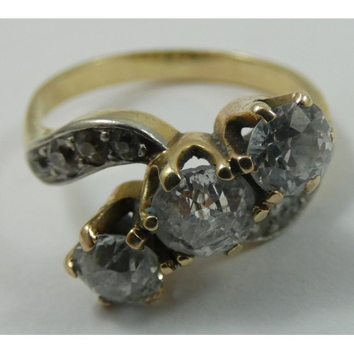 92 - A three stone diamond ring, claw set with an old cut stone, estimated to weigh 0.75 cts, colour esti... 