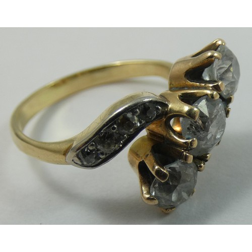 92 - A three stone diamond ring, claw set with an old cut stone, estimated to weigh 0.75 cts, colour esti... 