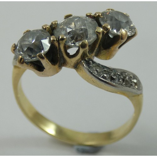 92 - A three stone diamond ring, claw set with an old cut stone, estimated to weigh 0.75 cts, colour esti... 