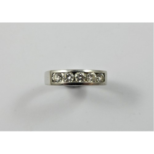 87 - A platinum and diamond five stone ring, channel set with brilliant cut stones, approximately 0.60 ct... 