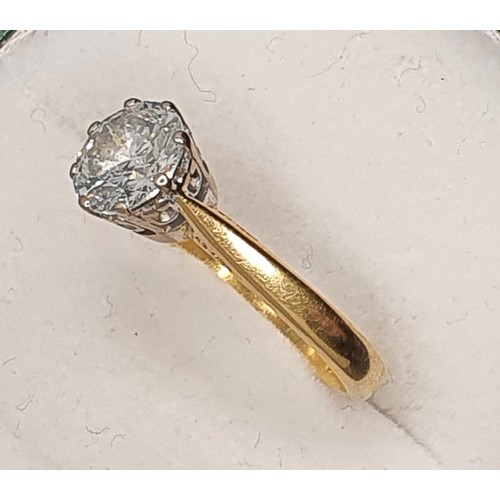 91 - A single stone diamond ring, claw set with a brilliant cut stone, calculated to weigh 1.20 cts, colo... 