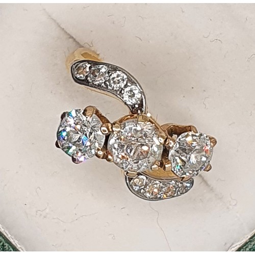 92 - A three stone diamond ring, claw set with an old cut stone, estimated to weigh 0.75 cts, colour esti... 