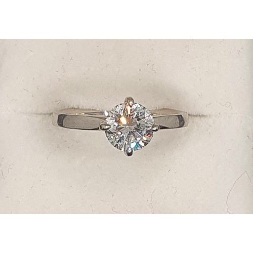 127 - A platinum and diamond single stone diamond ring, four claw set with a brilliant cut stone weighing ... 