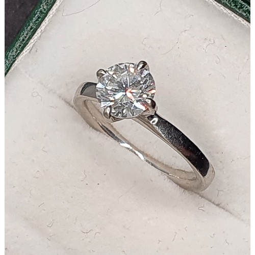 127 - A platinum and diamond single stone diamond ring, four claw set with a brilliant cut stone weighing ... 