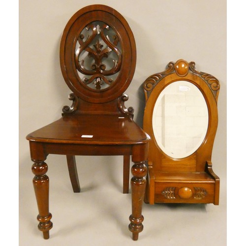 486 - A Victorian mahogany hall chair, with carved and pierced back, together with a mahogany hall mirror ... 