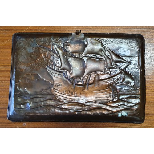 196 - A Newlyn School hammered copper charger, decorated with a galleon in full sail, with hammered border... 