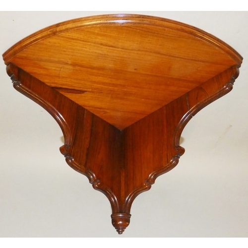 484 - Marsh, Jones & Cribb, late Kendell & Co., a Victorian rosewood corner shelf, the shaped panels with ... 