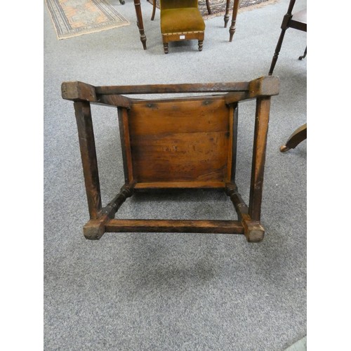 476 - An 18th century carved oak hall chair, with floral decorated back and stretcher supports, 95 cm.