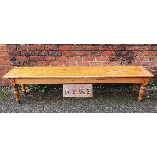 155 - A Highland Railway (HR) pitch pine waiting room bench, raised on turned legs, branded multiple times... 