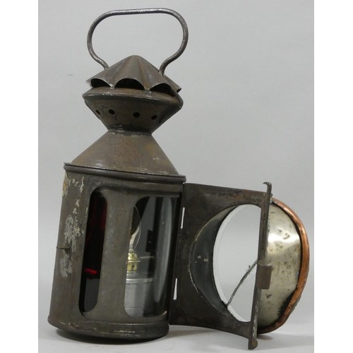 249 - A N.E.R. four aspect hand held lamp, with glasses and burner, front glass A/F.