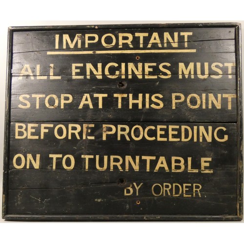 310 - A black and cream painted wooden sign relating to locomotives entering a turntable, 66 x 80 cm.