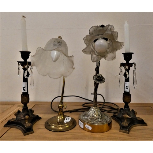 112 - A pair of metal and gilt candlesticks with glass drops, a tubular brass desk lamp with glass shade a... 