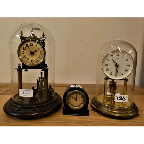 126 - An Edwardian brass Anniversary mantle clock, with dome, a Kundo example and a small circular ebonise... 