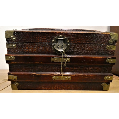 137 - A brass bound wood trunk, with a simulated crocodile skin finish, carry handles, the lid painted wit... 