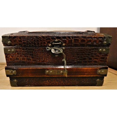 137 - A brass bound wood trunk, with a simulated crocodile skin finish, carry handles, the lid painted wit... 