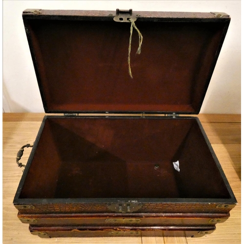 137 - A brass bound wood trunk, with a simulated crocodile skin finish, carry handles, the lid painted wit... 