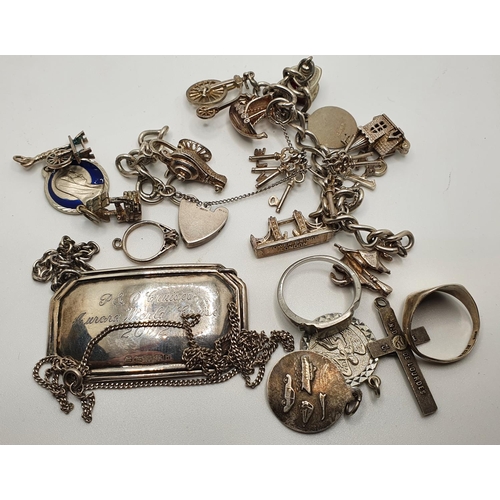 163 - A silver charm bracelet and other silver ware.