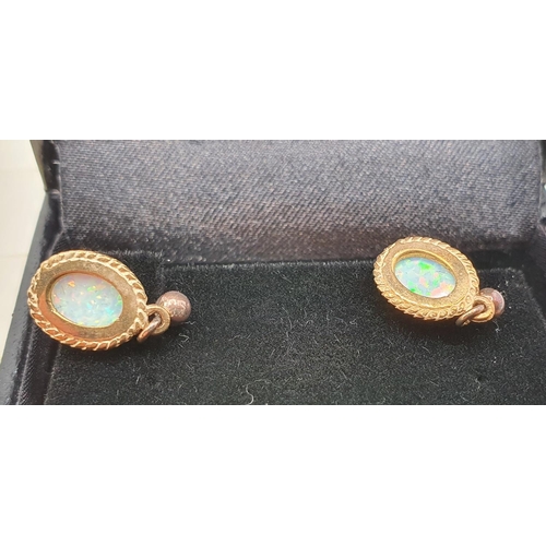 186 - A pair of 9ct gold and opal ear rings.