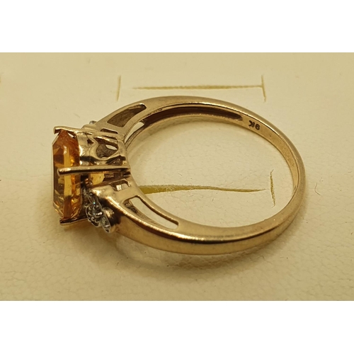 186A - A 9ct gold citrine (chipped) and diamond ring, 2.5 gms, size O1/2.