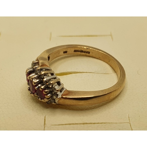 188 - A 9ct gold ruby and diamond triple cluster ring, 3.5 gms, size L 1/2.