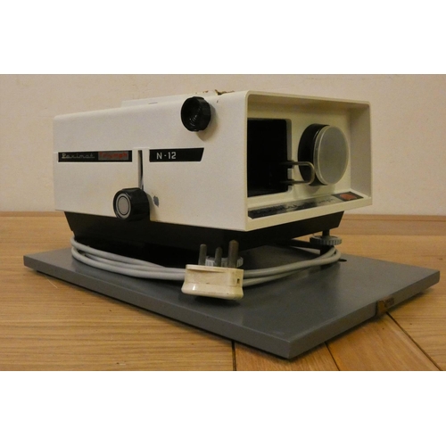 67 - An Eumig 820 Sonomatic sound projector, a Prinzmatic slide projector, a Paximat Triumph slide projec... 