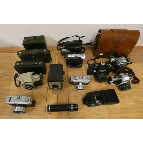 77 - A quantity of SLR camera's, to include Praktica EE2, Pentax MG, Olympus OM10 and two box Brownies.