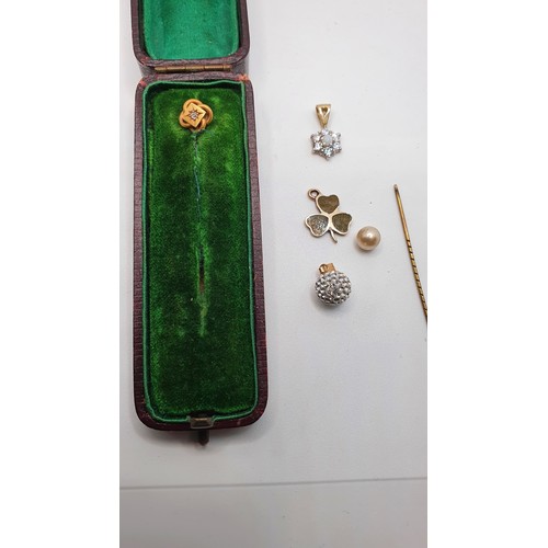 159 - A Victorian gold and diamond set stickpin, a 9ct gold and Connemara marble clover leaf charm and oth... 