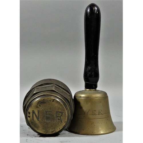 126 - A brass NER horse drawn cart locking wheel nut and a small NER handbell (2).