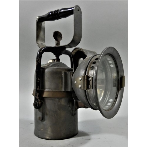 274 - A portable electric signalling lantern, a small silver LNER hand lantern, with burner and another ha... 