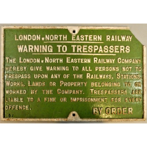 307 - A cast iron LNER warning to trespassers sign, lacking top right hand corner.