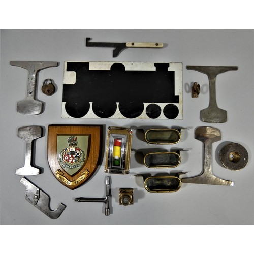 150 - A collection of railway related items, to include metal ashtrays, carriage key and a padlock.