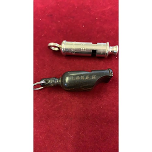 149 - A metal Police whistle and a plastic example (2).