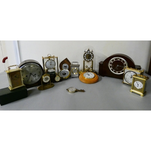 102 - A Kundo electromagnetic mantle clock, together with a anniversary dome table clock, a Westminster ch... 