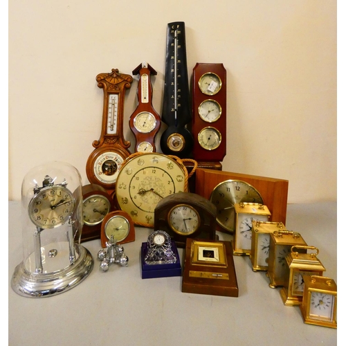 113 - A collection of carriage, anniversary, mantle clocks, and barometers.