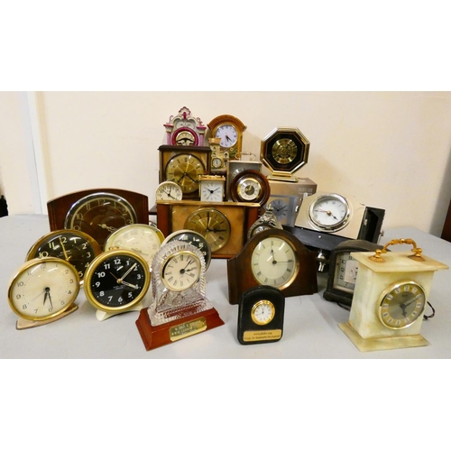 118 - A collection of carriage, alarm, anniversary, and mantle clocks in two boxes (2).