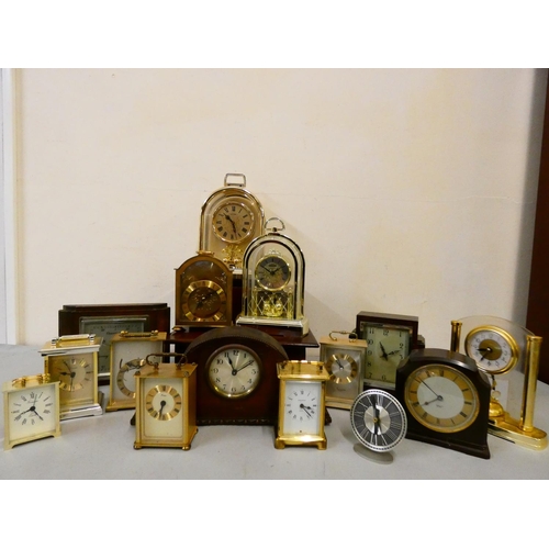 120 - A collection of mantle, carriage, anniversary, and electric clocks and barometers. (3)