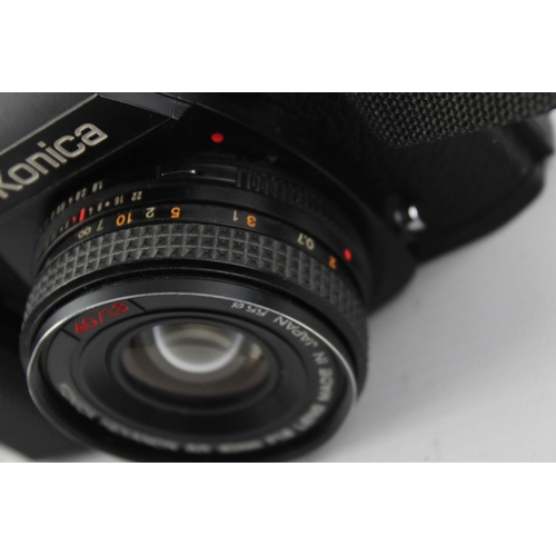 399 - Konica FS-1 SLR Film Camera w/ Konica Hexanon AR 40mm F/1.8 Pancake Lens  The camera is WORKING and ... 