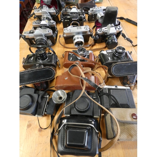 66 - A collection of cameras and camera bodies, including Minolta SRT 101, XG2, Sr1, X300, Hi Matic7, Zor... 