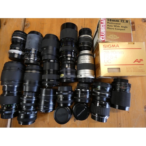 70 - A collection of camera lenses, makers to include Canon 80-200, Pentax 80-200 and others.