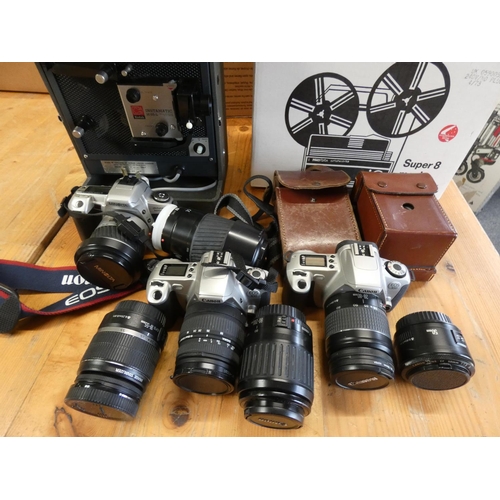 73 - A Minolta dynax 505 SI camera, a Canon EDS 300 camera & lenses (cased) together with various camcord... 