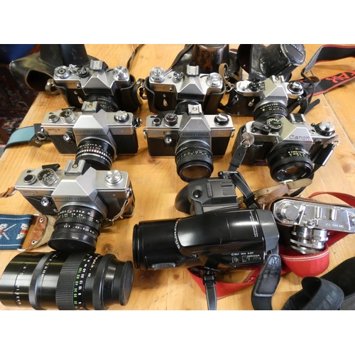 77A - A collection of cameras, to include Praktica 2 x MTL3,  Nova II, Pentax ME, and Zenit-E, M, together... 