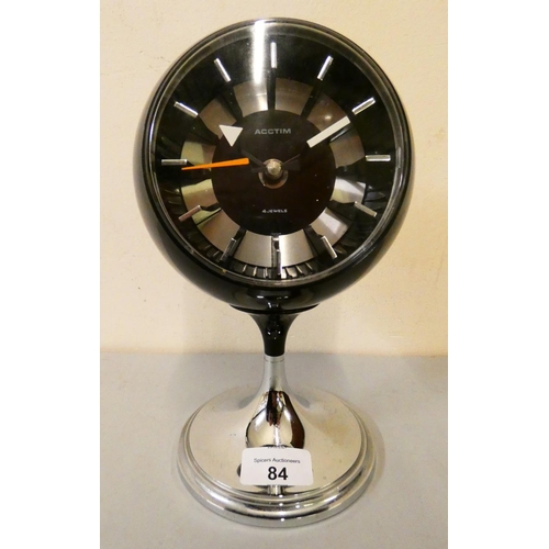 84 - A 1970s retro clock by Acctim, battery operated, black plastic case, sphere on chromed base. 23 cm t... 