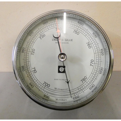 89 - A chromed cased bulk head fitting barometer from Lilley & Gillie, North Shields. 15cm diameter.